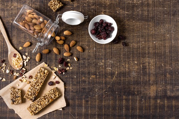 Top view cereal bars with copy space almonds