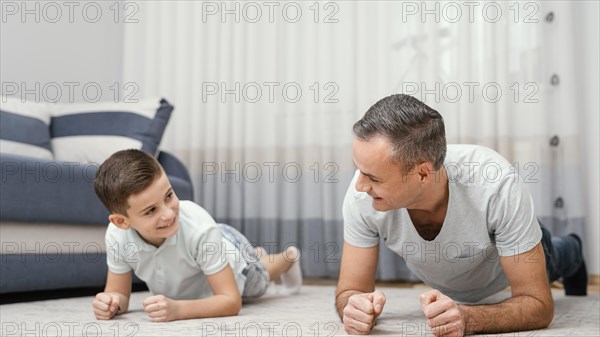 Father child playing indoors