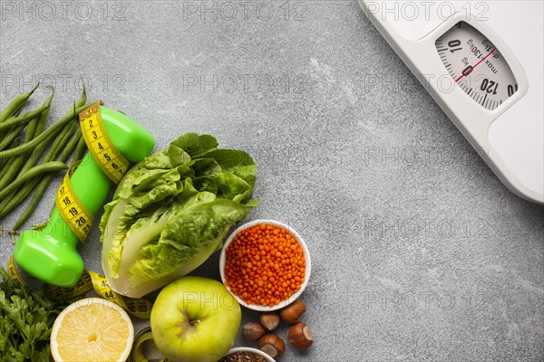 Scale with groceries gray background