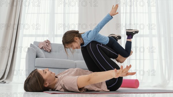 Mother training with child home