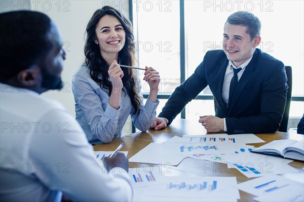 Three businesspersons meeting