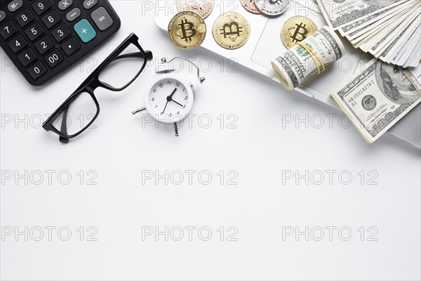 Top view coins paper money laptop