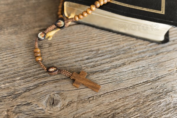 High angle cross rosary with holy book