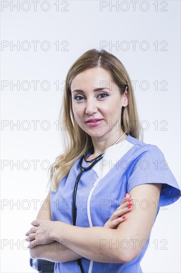 Portrait young female dentist white background