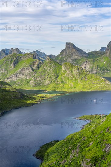 Mountain landscape with pointed mountain peaks and fjord Forsfjorden with village Vindstad
