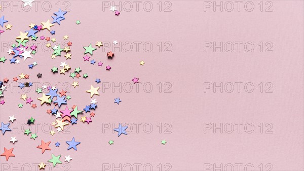 Confetti stars pink background with copy space