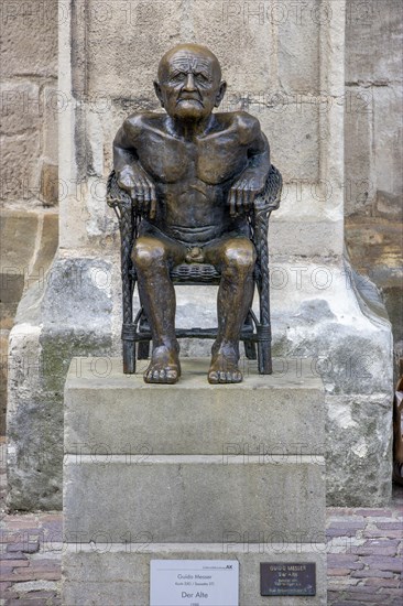 Bronze sculpture The Old Man by Guido Messer in front of the Protestant Town Church