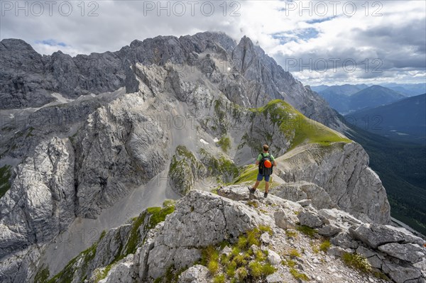 Mountaineer at the summit of the Suedliche Riffelspitze