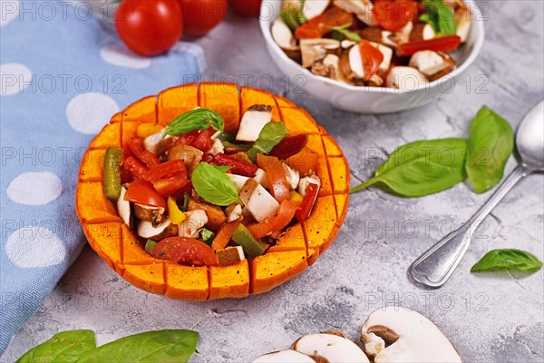 Vegan baked Red kuri squash vegetable filled with bell pepper