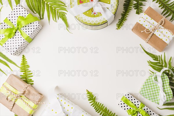 Decorative gift boxes leaves twig arranged white background