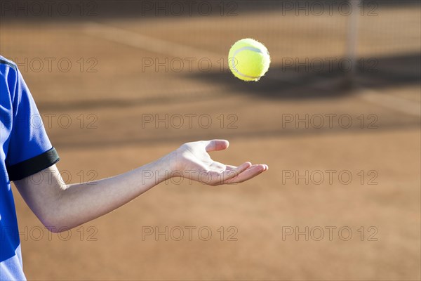 Kid playing with tennis ball
