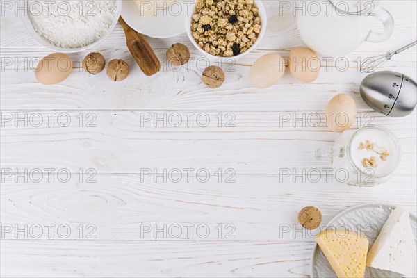 Top view healthy food ingredients tools white wooden table