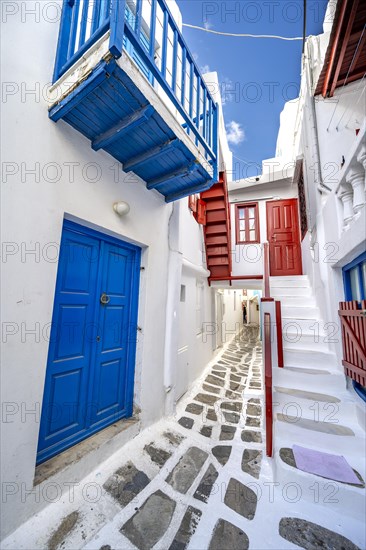 Cycladic white houses with colourful doors and shutters