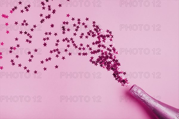 Pink bottle champagne with star form glitter