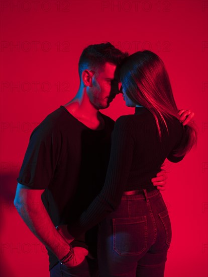 Young man black hugging pretty woman