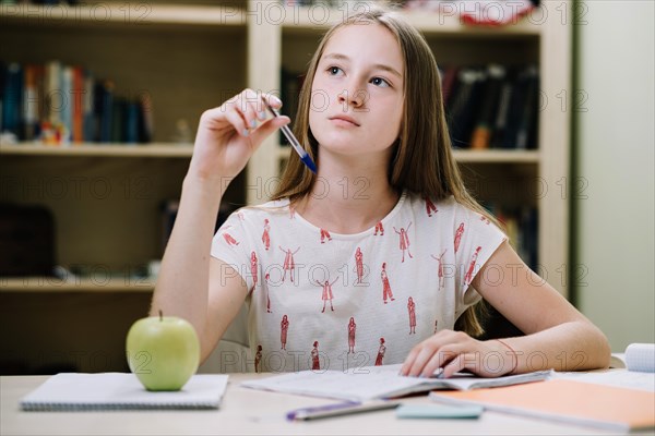 Dreamy girl studying