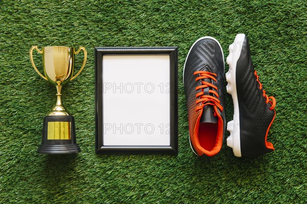 Football composition with frame trophy shoes