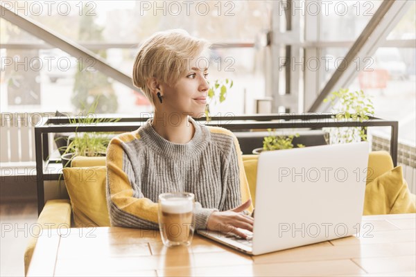 Lance woman working with laptop coffee shop