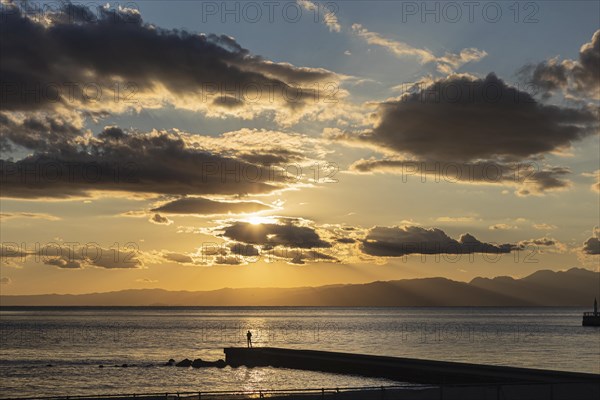 Man fishing at sunset