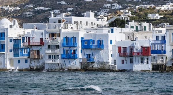 White Cycladic houses on the shore