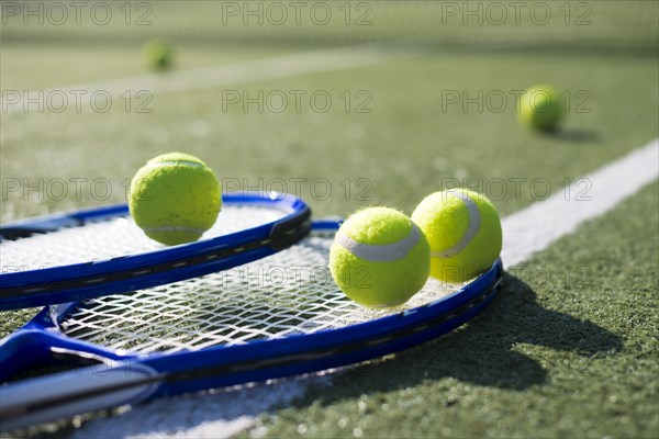 Close up tennis rackets balls ground