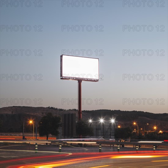 Blank advertising billboards illuminated highway night