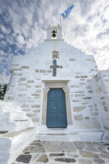 White Greek Orthodox Church Holy Church of Agios Konstantinos with Greek flag