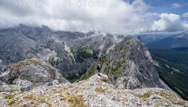 Mountaineer at the summit of the Waxenstein