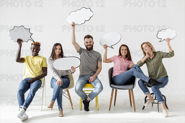 Low angle friends chairs with chat bubbles