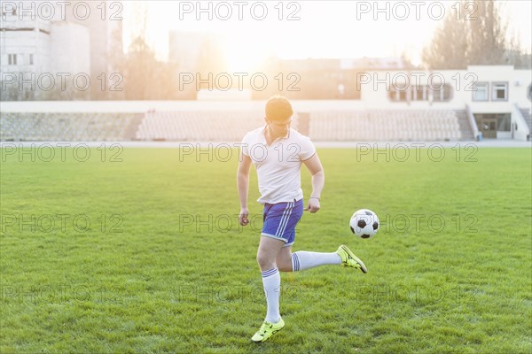 Young man performing back kick