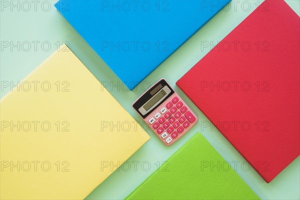 Colorful books with calculator center