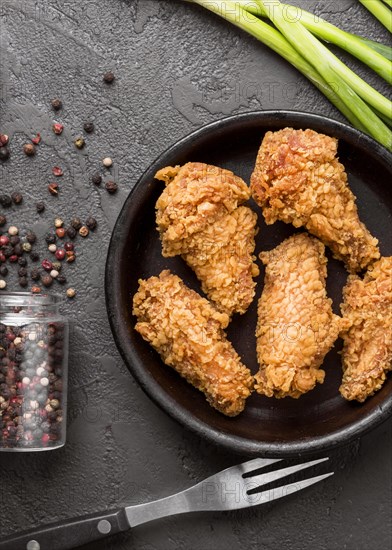 Top view fried chicken with pepper green onions