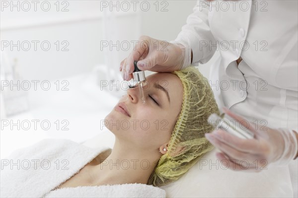 Woman beauty clinic face treatment