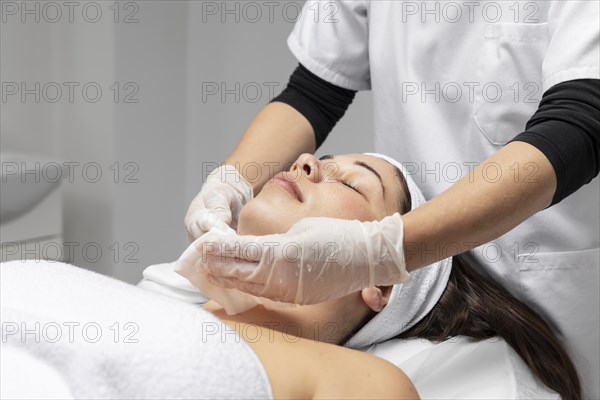 Young woman having facial skincare treatment