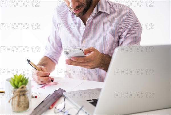 Business man working with mobile phone laptop