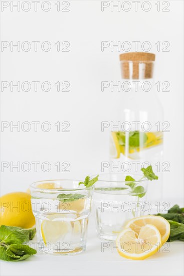 Glasses bottle with lemon mint drink