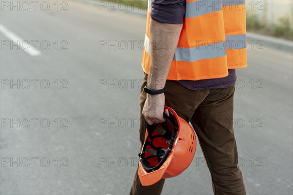 Back view man with protection helmet