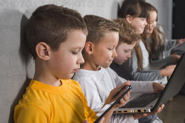 Children using electronic devices