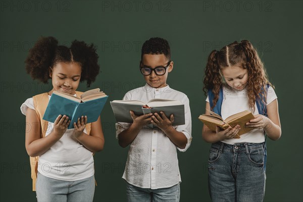 Front view school kids reading