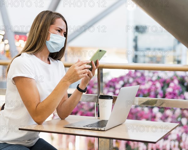 Side view young woman wearing face mask