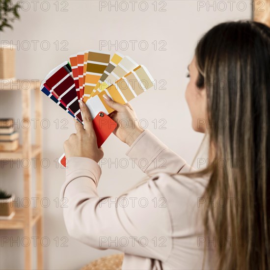 Close up woman holding palette colours