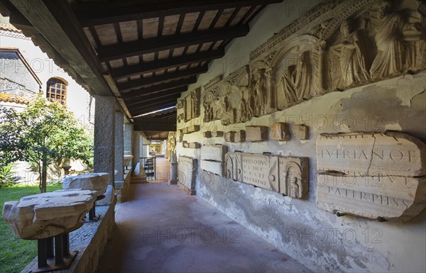 Ancient fragments of sculptures in the Grado Lapidarium