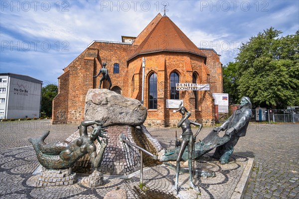 Market fountain in front of ruined St Mary's parish church