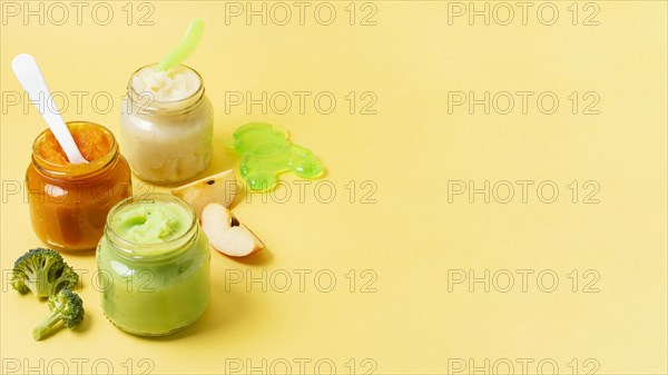 Baby food frame jars yellow background