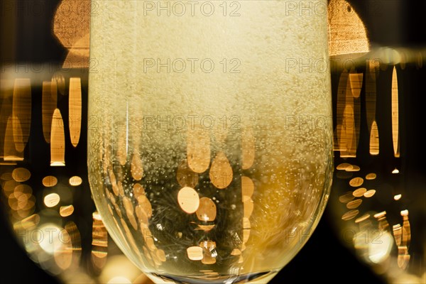 Close up champagne bubbles glasses