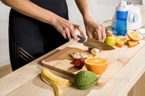 Fitness woman preparing detox juice