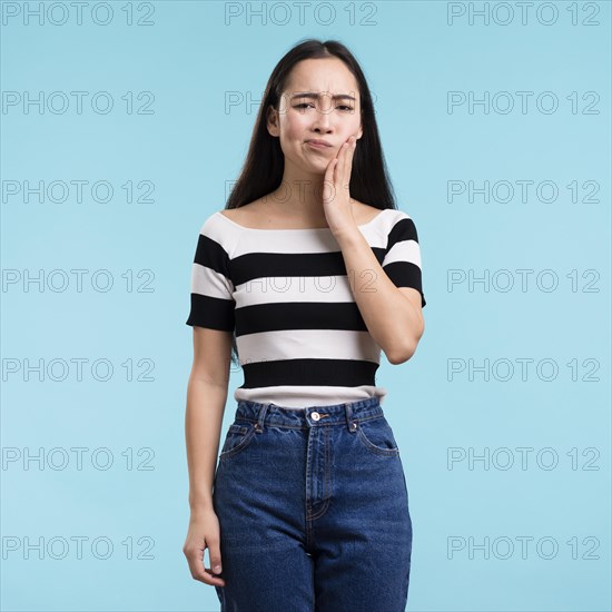 Young woman with tooth pain