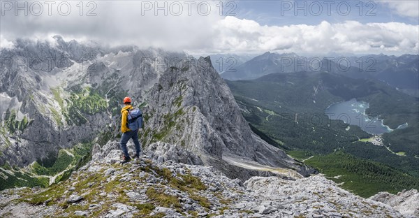 Mountaineer at the summit of the Waxenstein