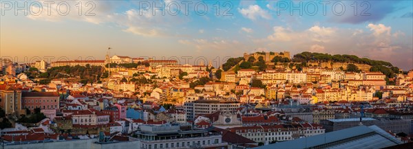 View of Lisbon city from Miradouro de Sao Pedro de Alcantara viewpoint on sunset. Lisbon