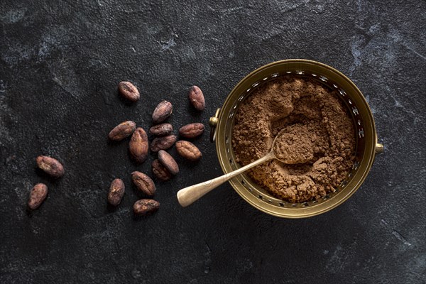 Top view bowl with cocoa powder cocoa beans